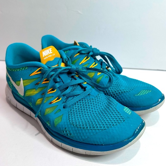 Nike Shoes - Nike women’s Teal and Yellow Athletic Shoes